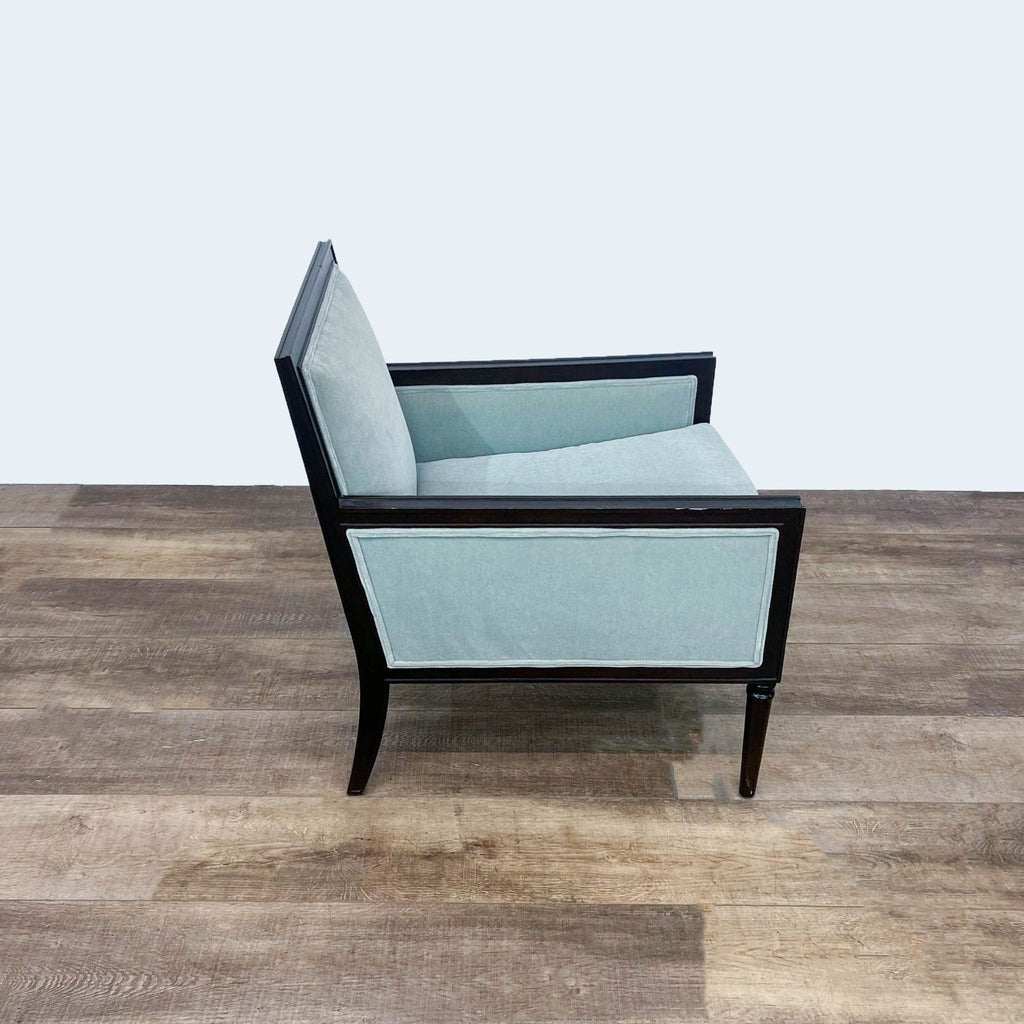 Reperch brand transitional armchair with black wood frame and light blue velvet upholstery, on a wood floor.