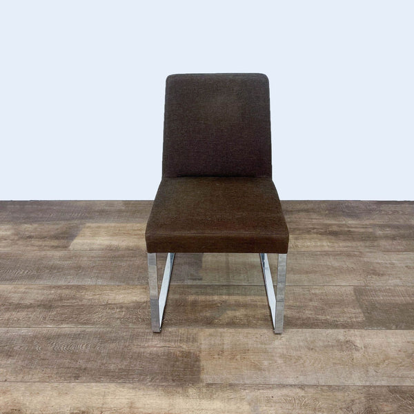 Alt text 1: Brown upholstered Calligaris contemporary dining chair with a straight steel base, set against a wooden floor background.