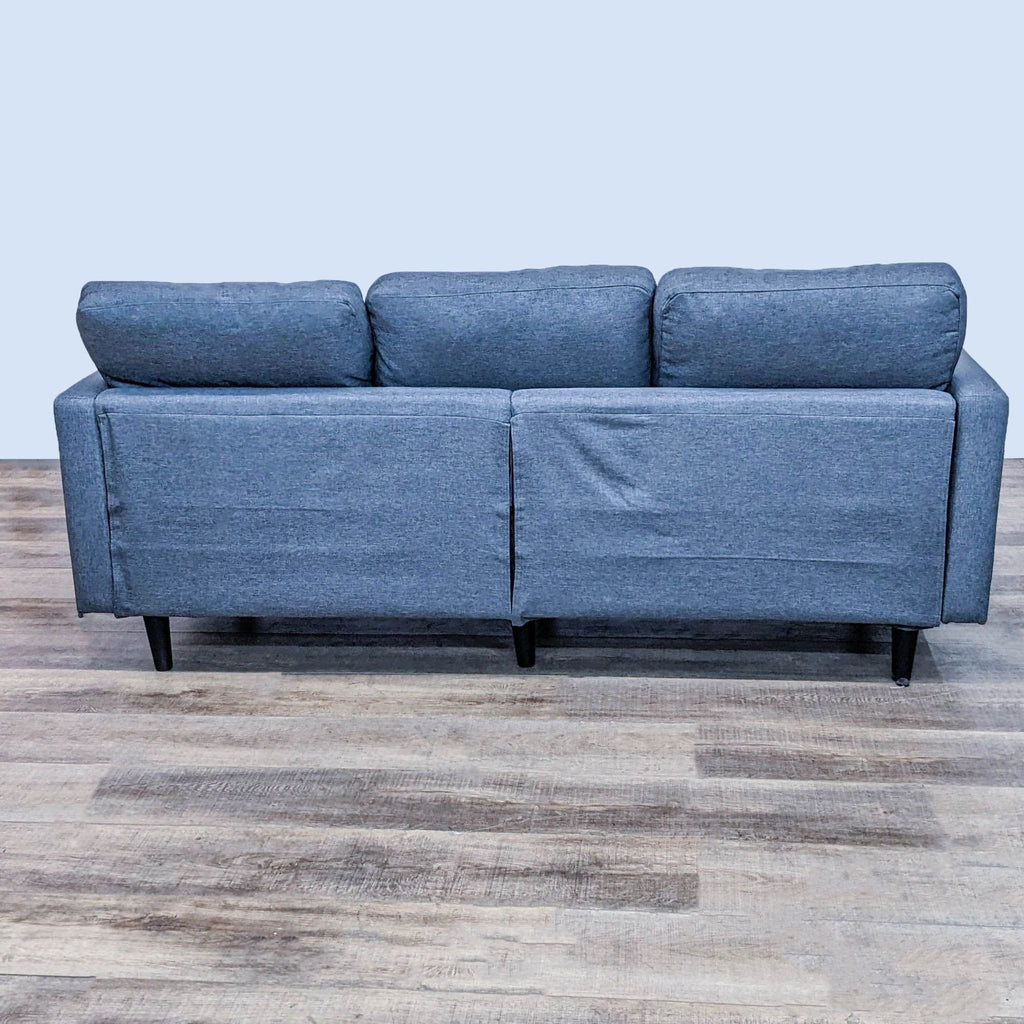Alt: Reperch brand 3-seat narrow arm sofa with dark finish feet and grey upholstery on wooden floor.