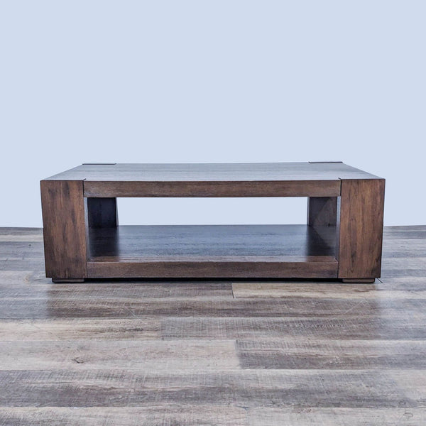 Crate & Barrel coffee table with hand-planed, wire-brushed walnut veneer surface, on hardwood floor.