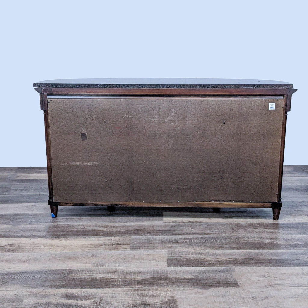 Bernhardt Art Deco style sideboard with cherry/mahogany finish and black granite top, viewed from the back.