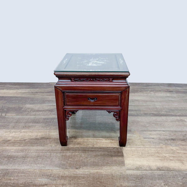 Reperch branded end table with protective glass top and intricate Mother of Pearl inlay on wooden surface.