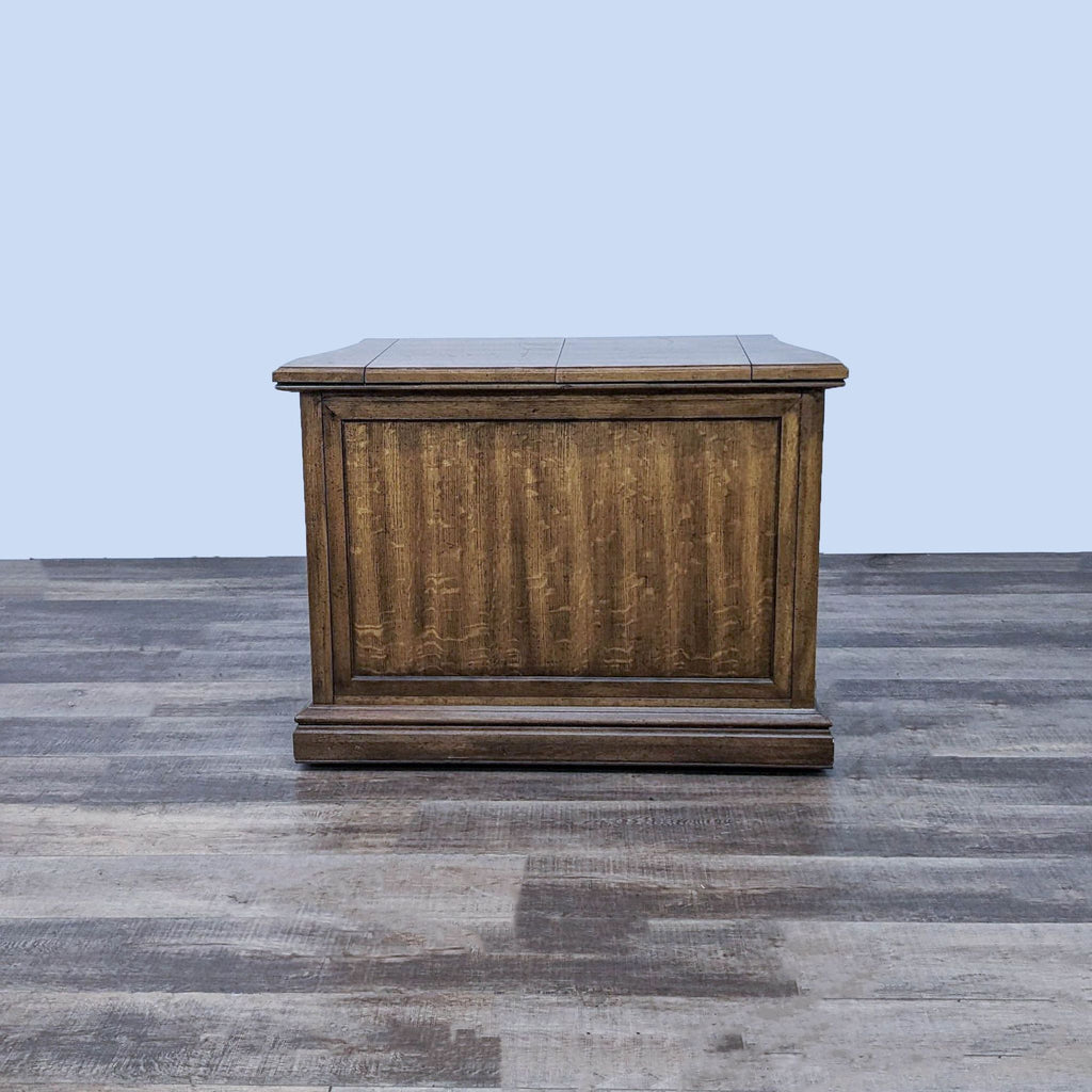 Reperch burlwood buffet server with stone insert on wooden floor against a blue background.
