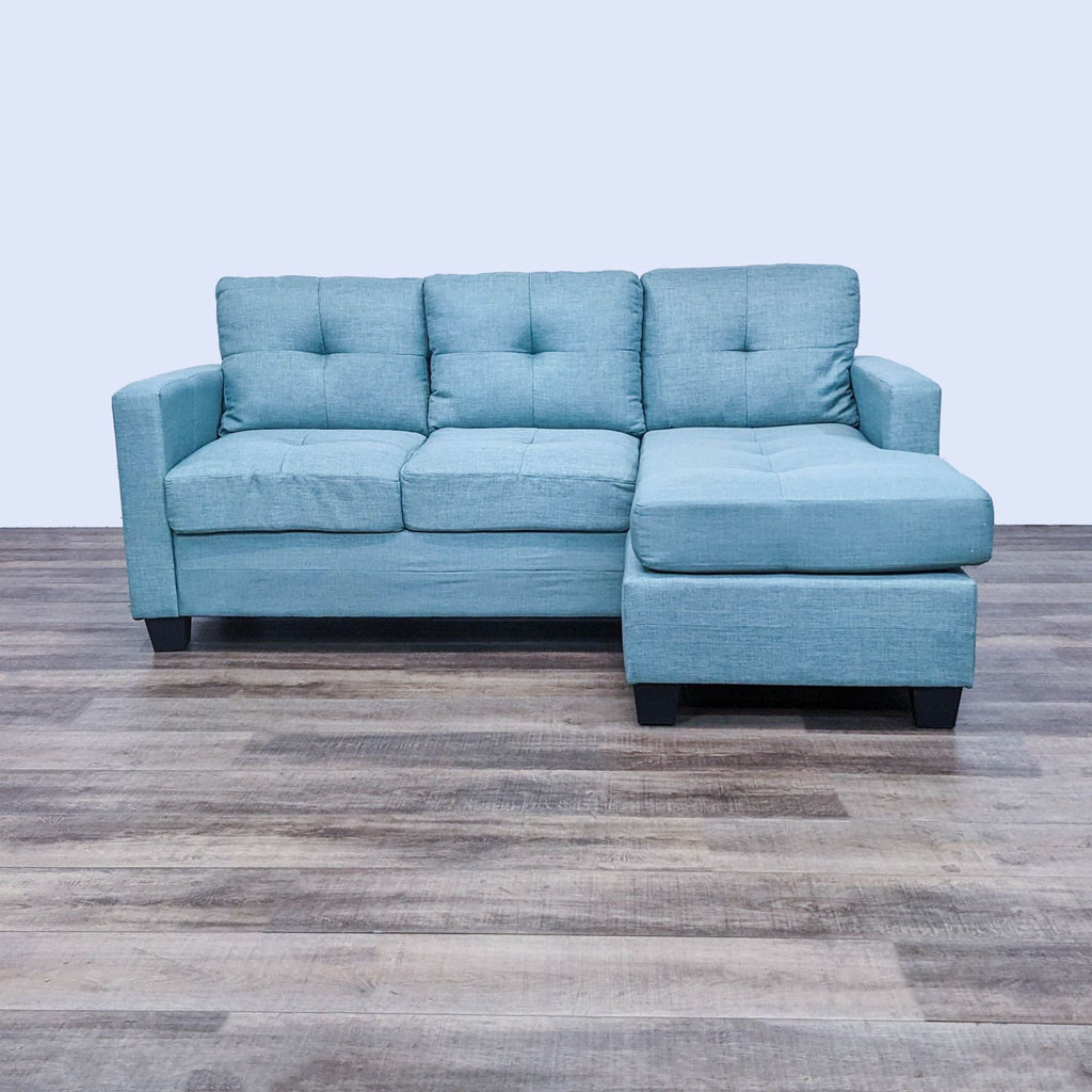 a couch with a blue couch cushions and a blue chair 