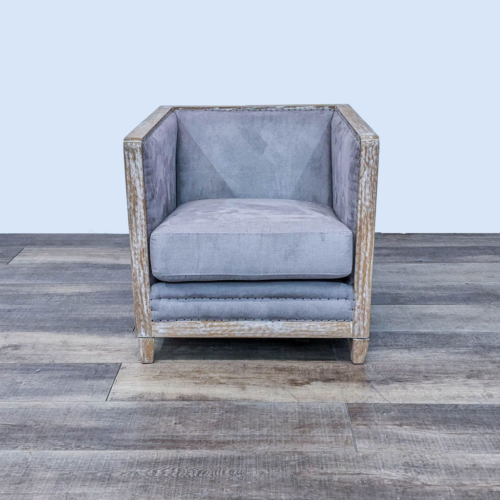 Rustic Hartland chair by New Pacific Direct with a white-washed wood frame and grey microfiber upholstery, on a wood floor.