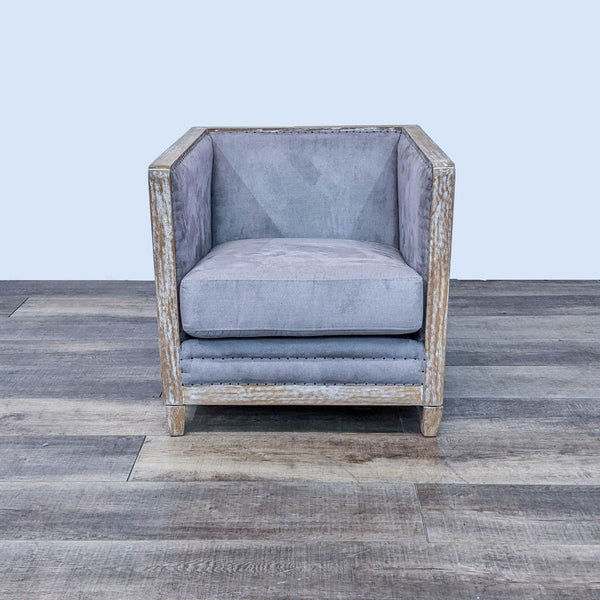 Rustic Hartland chair by New Pacific Direct with a white-washed wood frame and grey microfiber upholstery, on a wood floor.