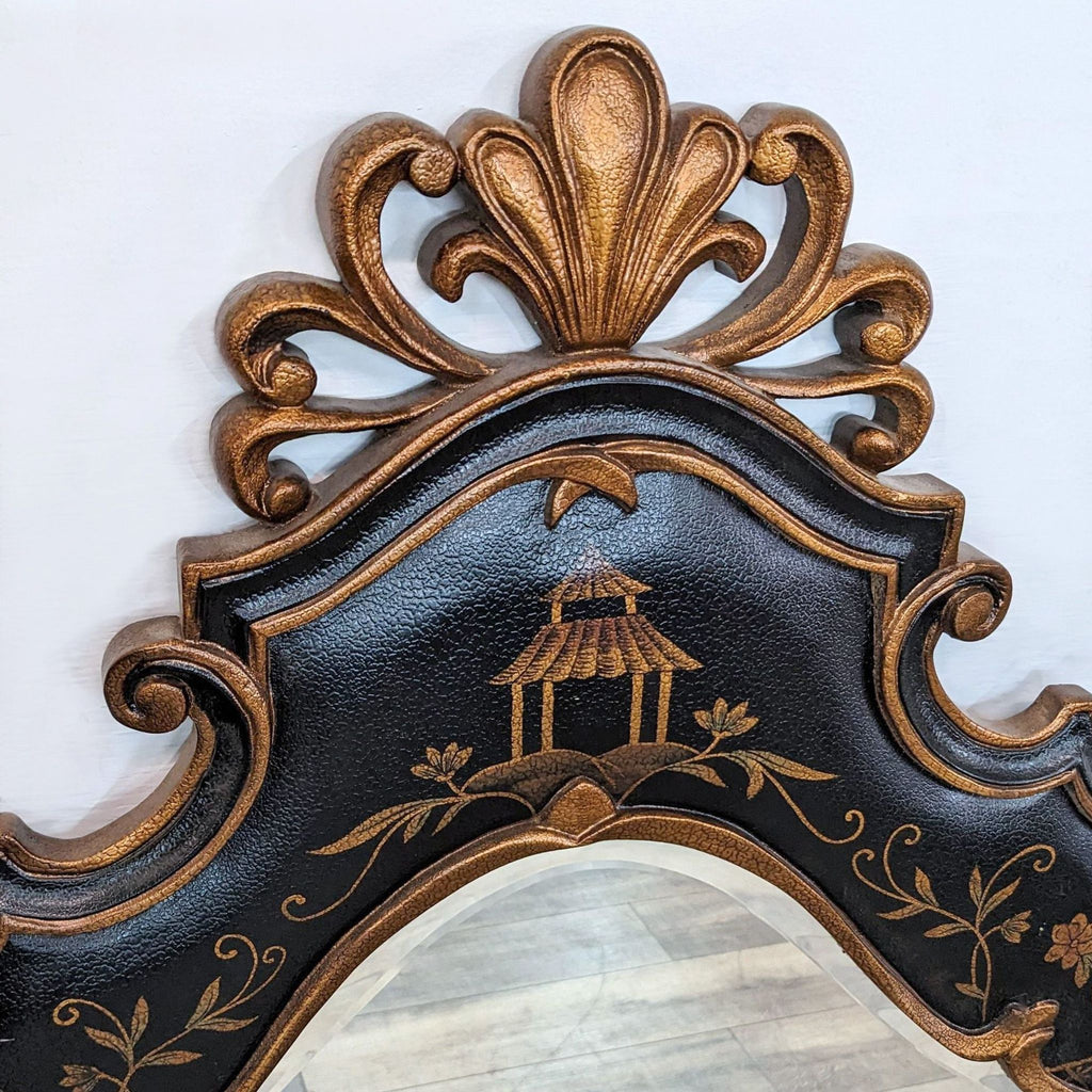 Detailed close-up of Ethan Allen gilt mirror showcasing chinoiserie decoration and pagoda motif atop Rococo curves.