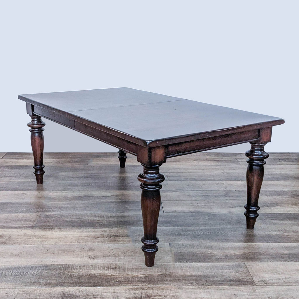 Pottery Barn Montego expandable dining table with turned legs and dark walnut finish, traditional style.