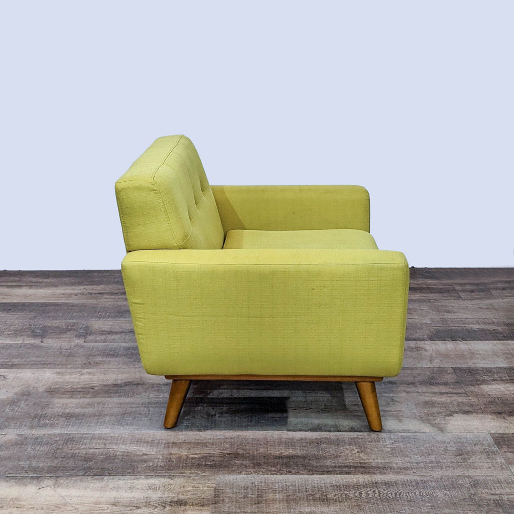 Mustard yellow Modway Engage armchair displaying button-tufted detailing and tapered wood legs, showcasing mid-century style.
