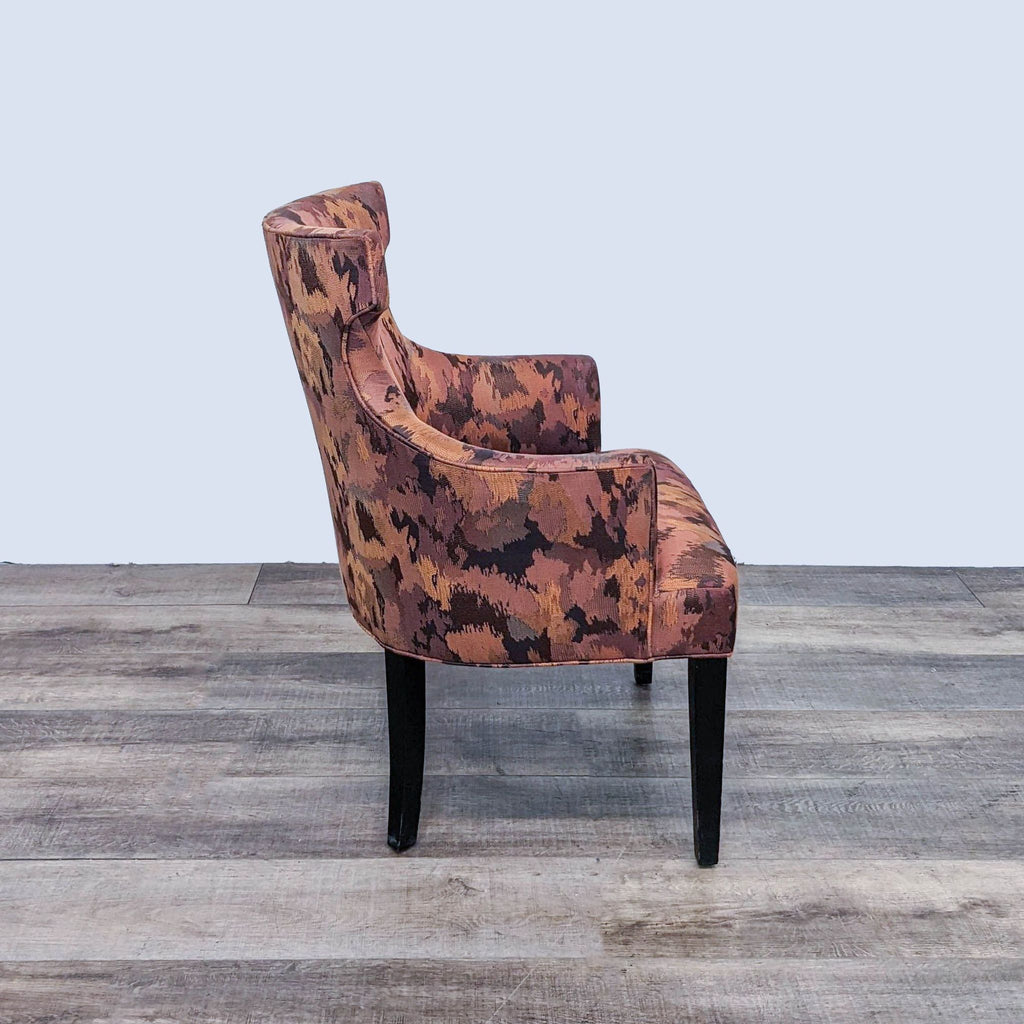 Reperch Alinea contemporary wingback chair with camouflage-like design, angled view on wood flooring.