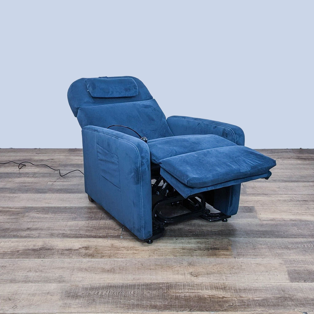 Alt text 2: Blue Relax The Back zero gravity recliner with extended leg rest and power cord on wooden floor.