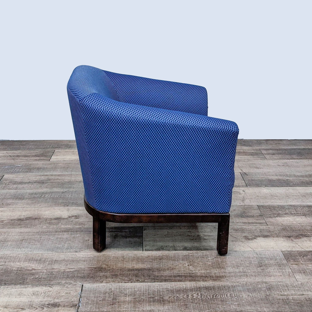 Side view of Brayton Herron lounge chair showcasing the Sweepstakes Sky upholstery and wood feet on a hardwood floor.