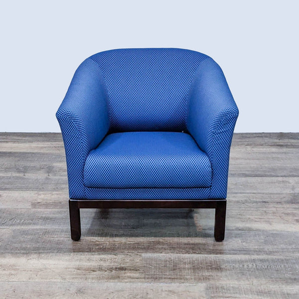 Brayton International Herron lounge chair with curved back and rolled arms in Sweepstakes Sky fabric, wood feet visible.