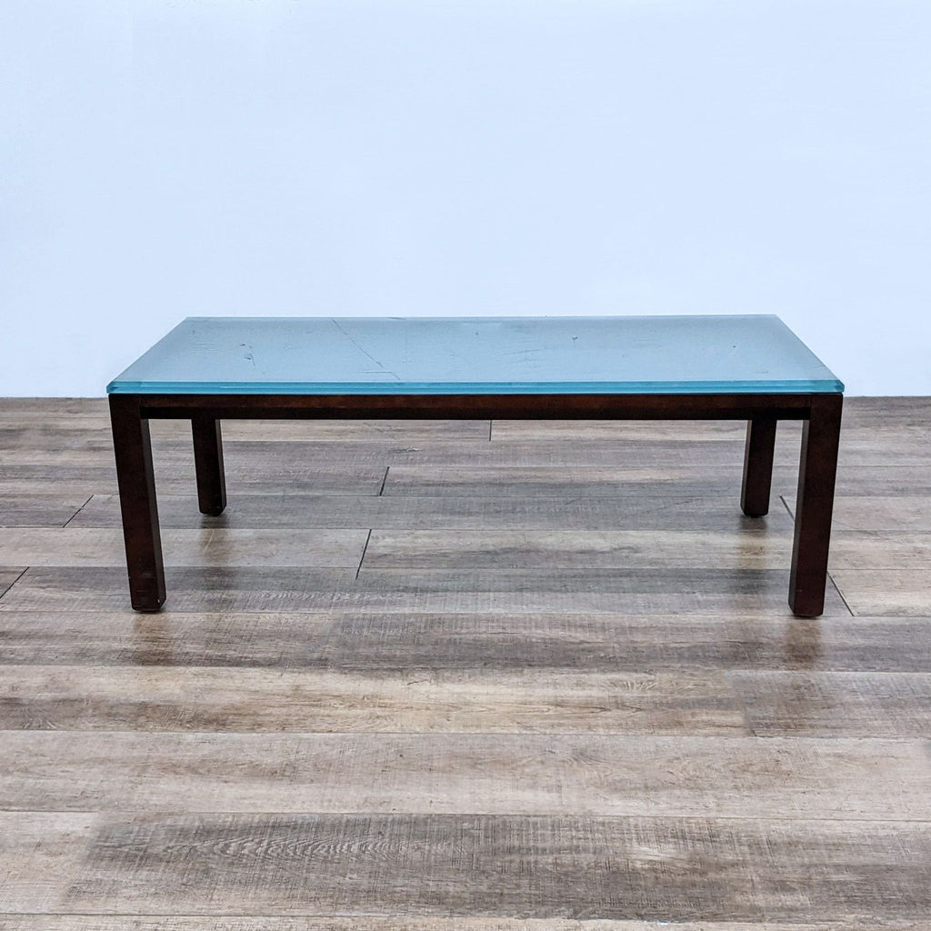 Reperch brand coffee table with a dark wood base and a frosted glass top, viewed from the front.