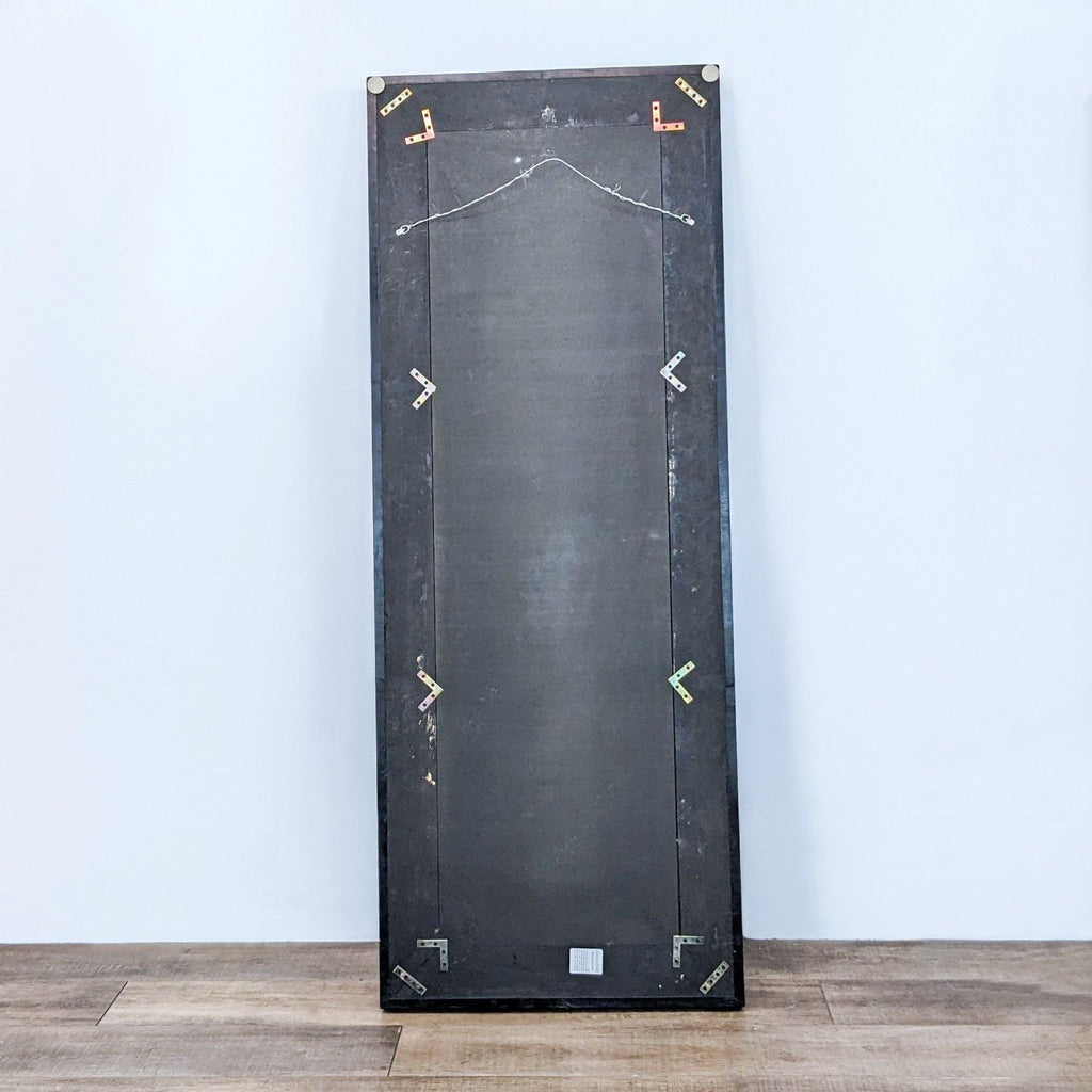 Back view of a Reperch full-length mirror showing the construction and wall mounts.