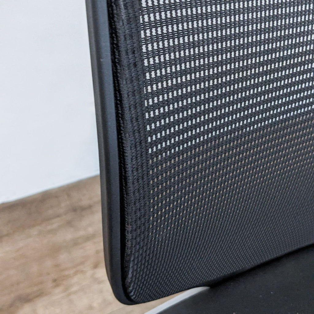 Close-up view of HON stretch mesh back texture on a modern barstool, highlighting the brand imprint on the backrest.