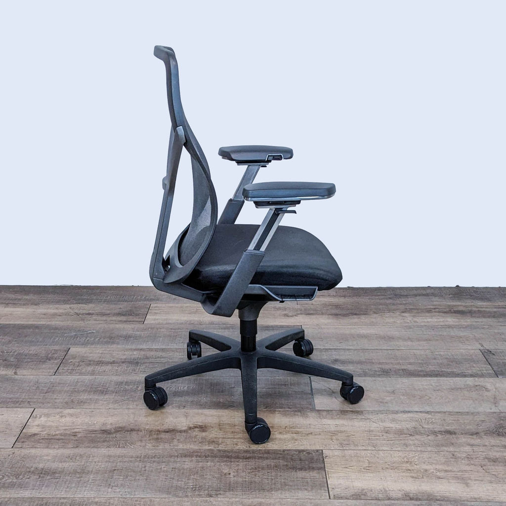 Modern AllSteel Acuity office chair with breathable back and padded seat, showing side adjustable controls.