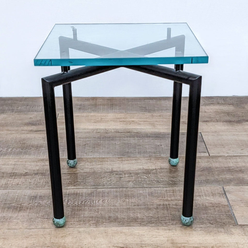 Reperch-branded side table with metal base and square glass top, featuring unique X-shaped supports.