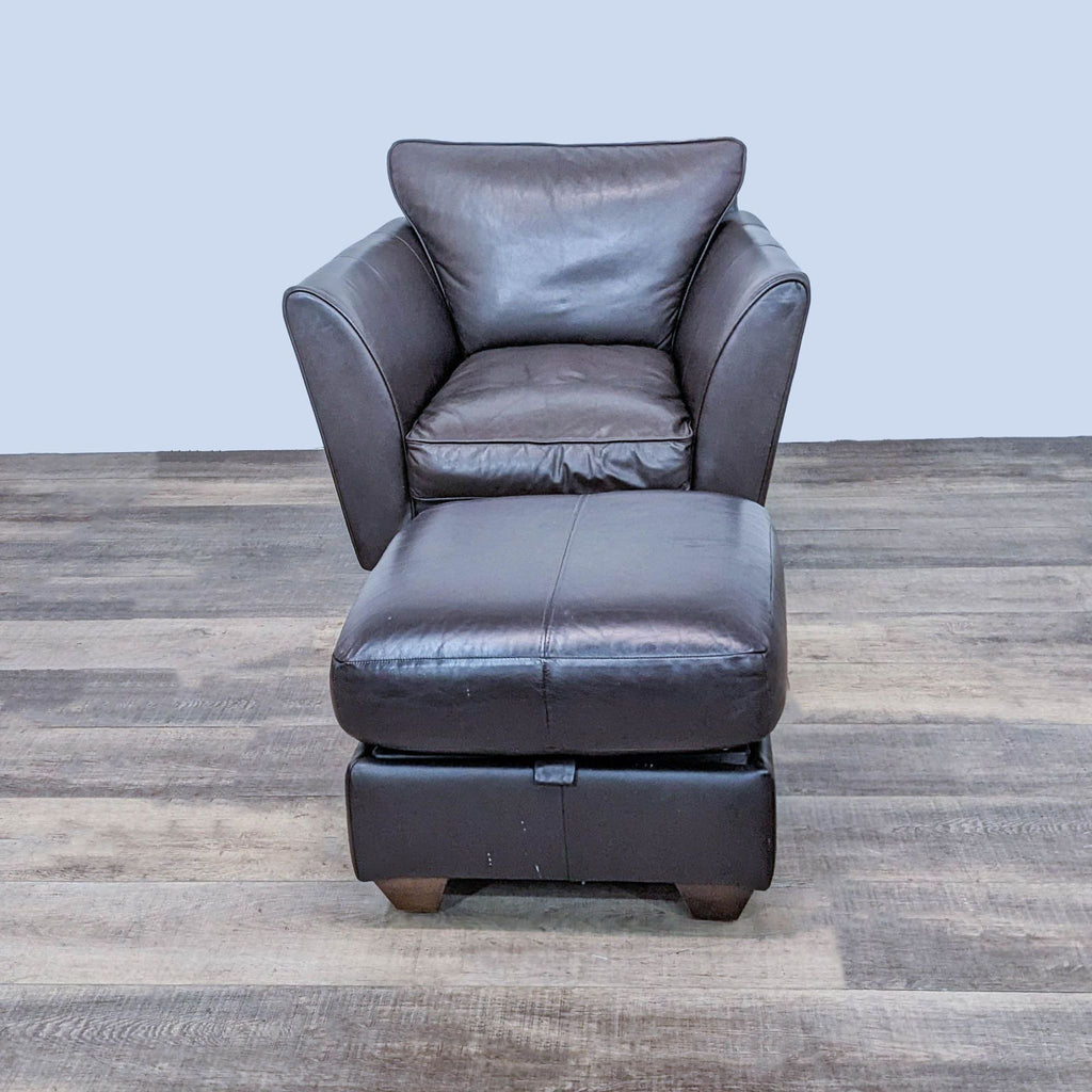 Marks & Spencer contemporary dark leather armchair with cushioned seat and high backrest, plus matching ottoman with storage.