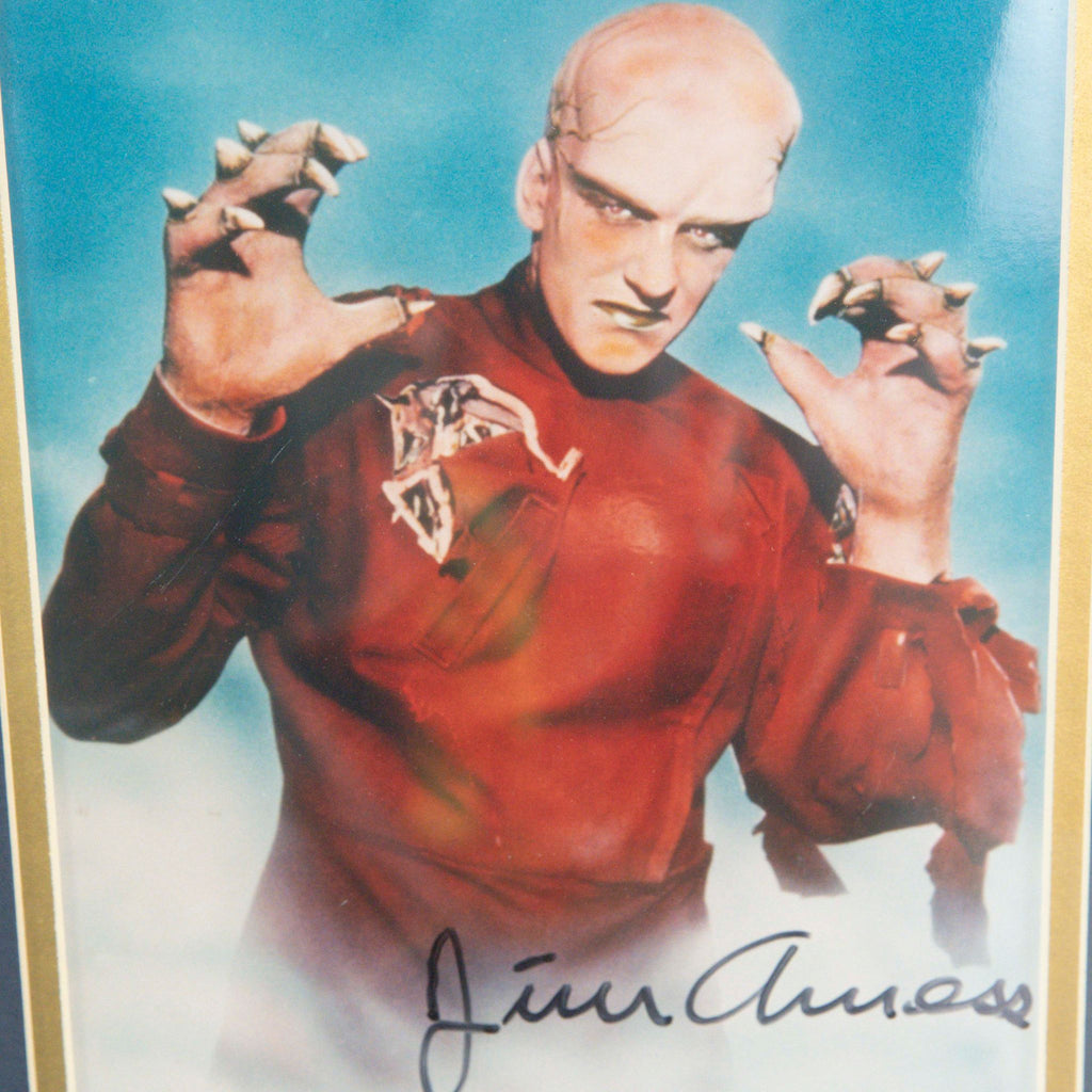 2. Close-up of a Reperch movie photo print featuring a monster character, hand-signed at the bottom.