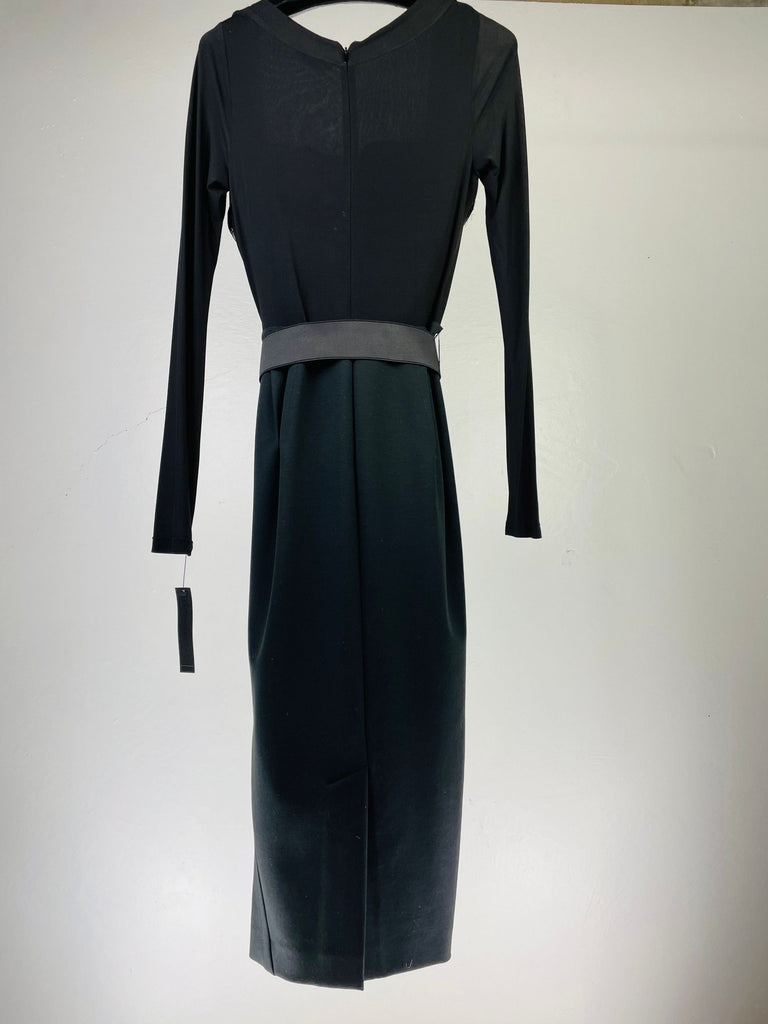 Front view of a Donna Karan black, knee-length dress with long sleeves and a belted waist.