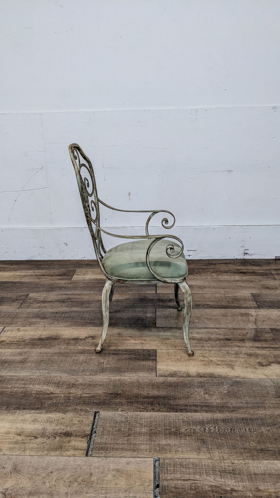 Artistic Metal Designs side chair with metal scroll work and Sage Doro Suede fabric seat on wooden floor.