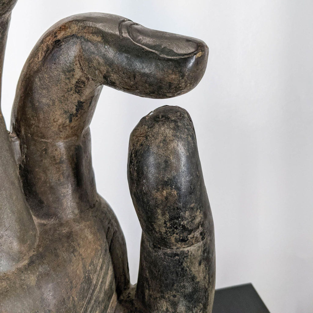 3. Close-up of the bronze Buddha hand sculpture’s detailed fingers forming the vitarka mudra, by Reperch.