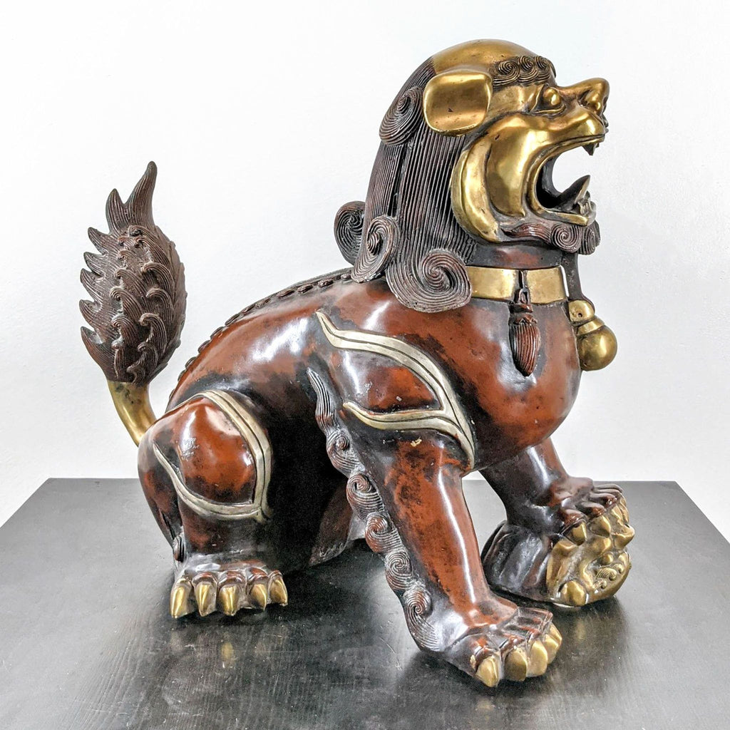 Side view of a Reperch metal Foo Dog guardian statue, showcasing intricate detailing on body and paws.