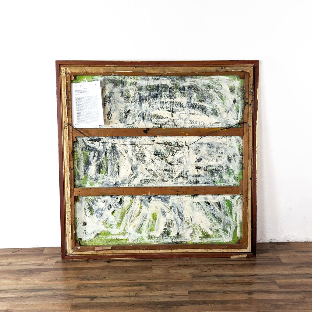 1. The back of a framed Reperch painting is shown with visible wooden supports and an attached document.