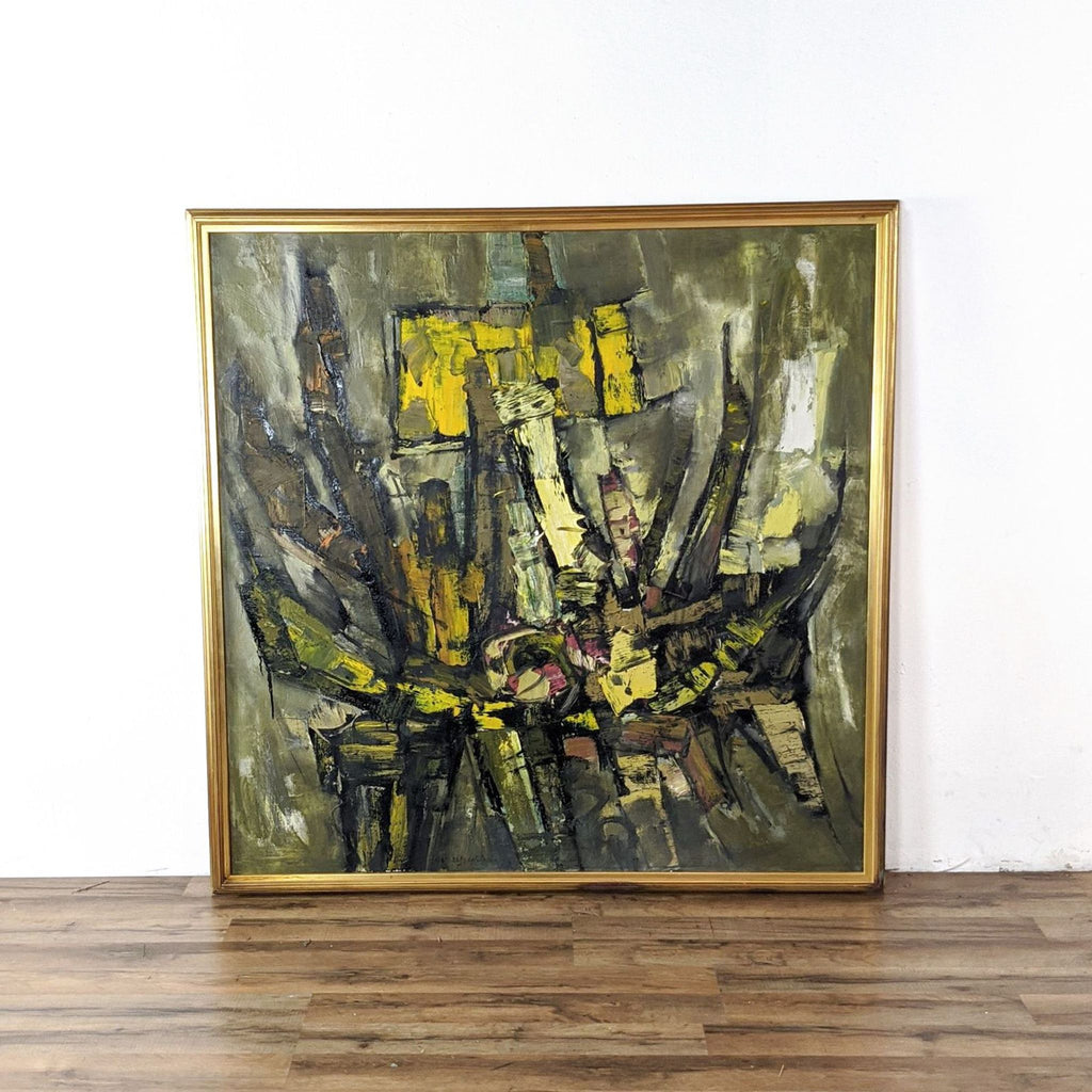 3. Framed Reperch abstract painting with bold yellow, brown, and green shapes displayed against a white wall.