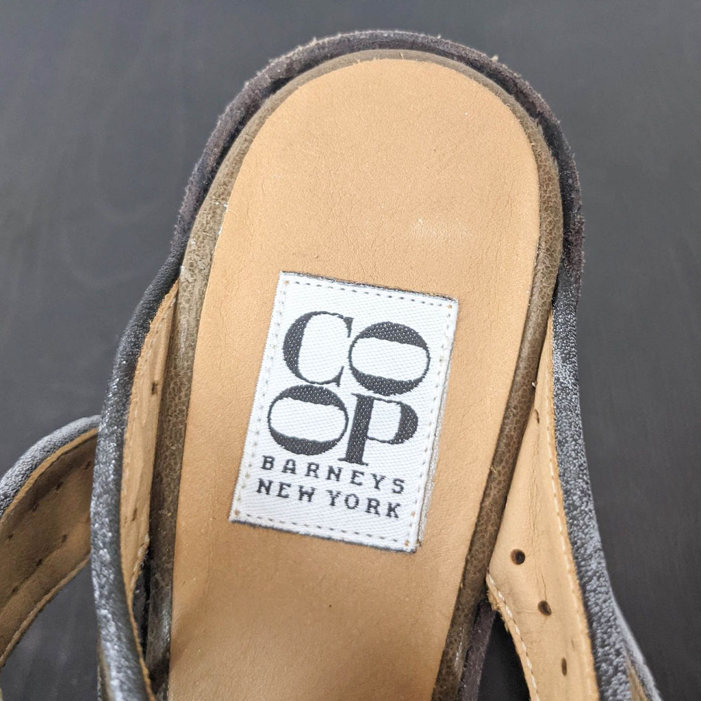Label of Barneys New York CO-OP on the insole of a suede shoe.