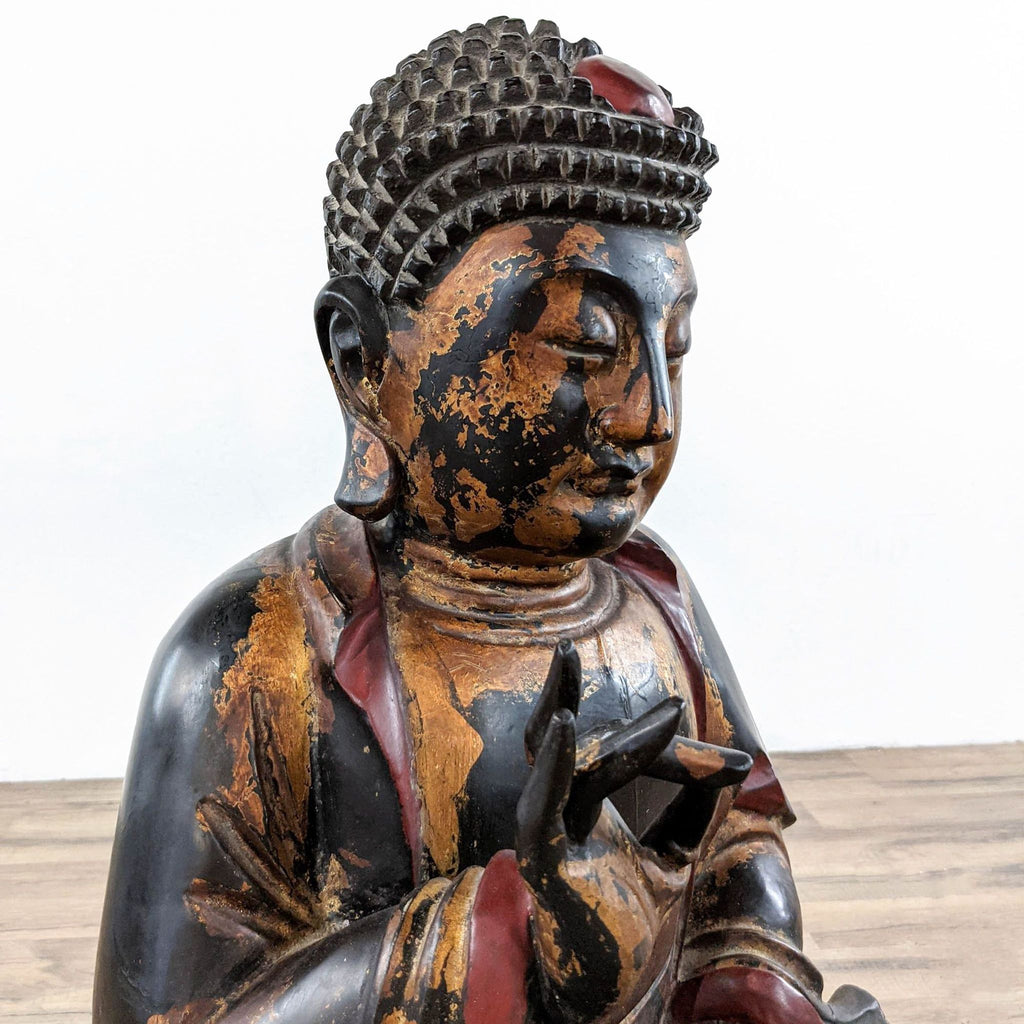 2. Close-up of Reperch Buddha statue’s serene face and gesture, showing worn gilded wood texture.  